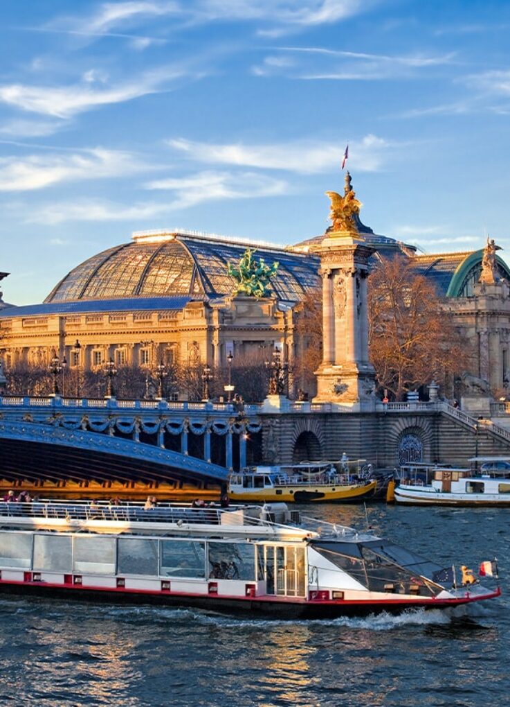 Paris Grand Palais and the Seine with barge on the Seine